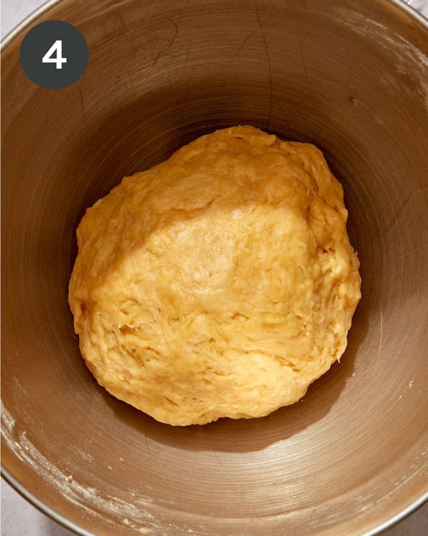 Liege waffle dough in a stand mixer in a ball.