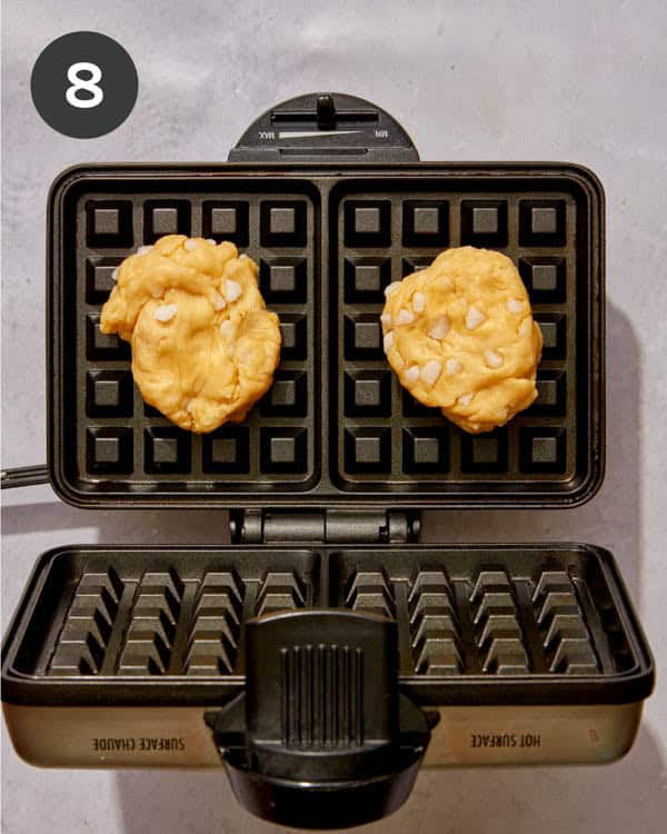 Liege waffle dough on a waffle iron ready to be cooked.