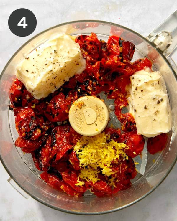 Ingredients in a food processor to make tomato butter pasta.