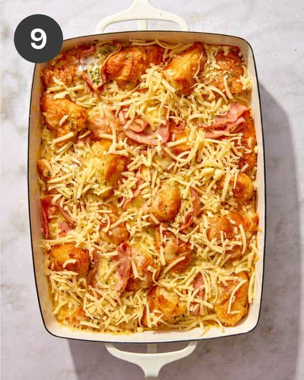 A croissant bake with cheese on the top about to go in the oven.