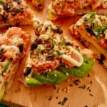 Close up on a slice of sushi pizza.