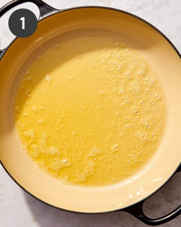 A skillet with melted butter.