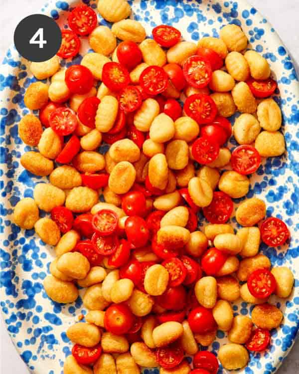Pan fried gnocchi with cherry tomatoes.