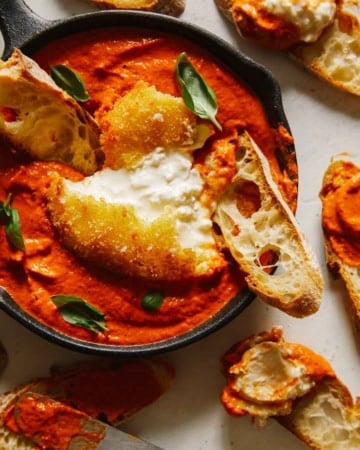 Fried burrata over romesco sauce with bread.