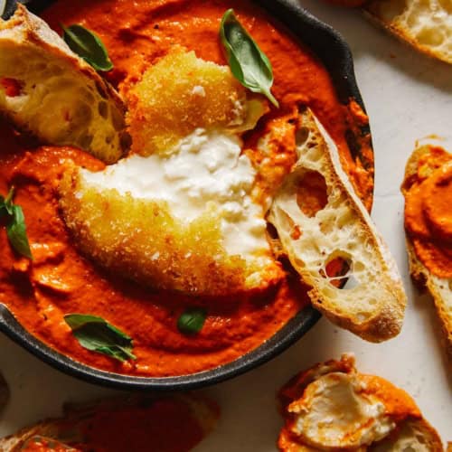Fried burrata over romesco sauce with bread.
