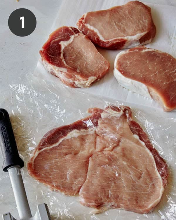 A pounded pork tenderloin with three more in the background.